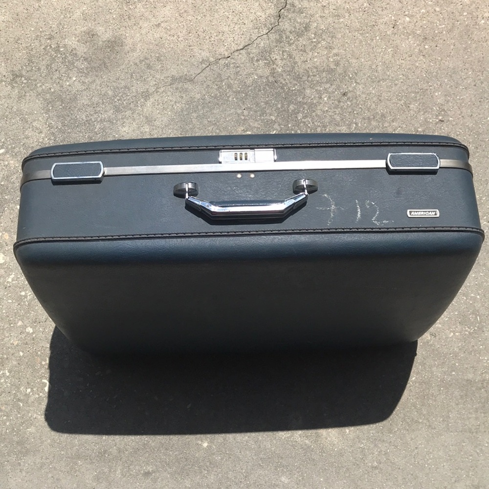 American flyer hard shell vintage luggage.